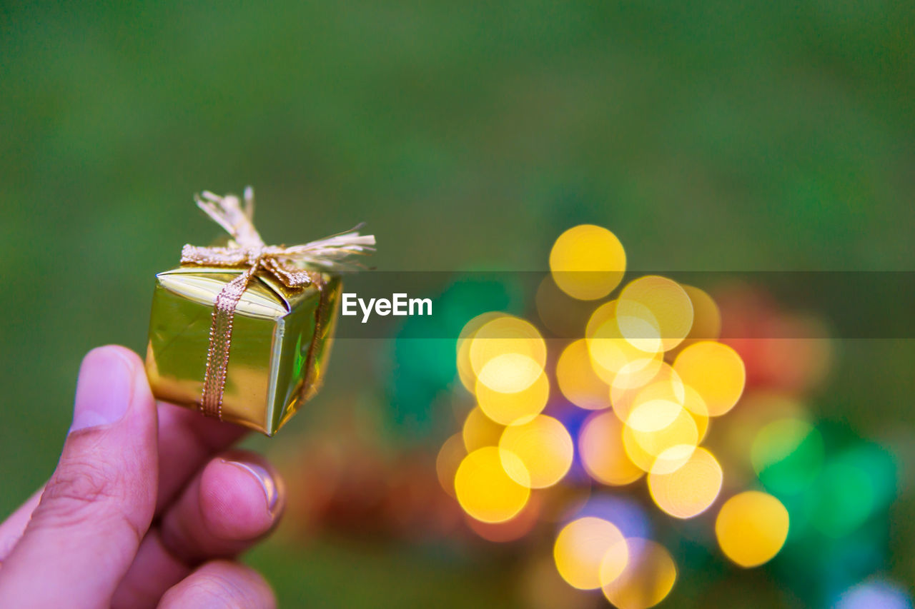 Close-up of hand holding christmas gift