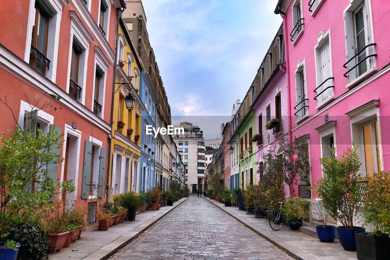 Street amidst buildings against sky