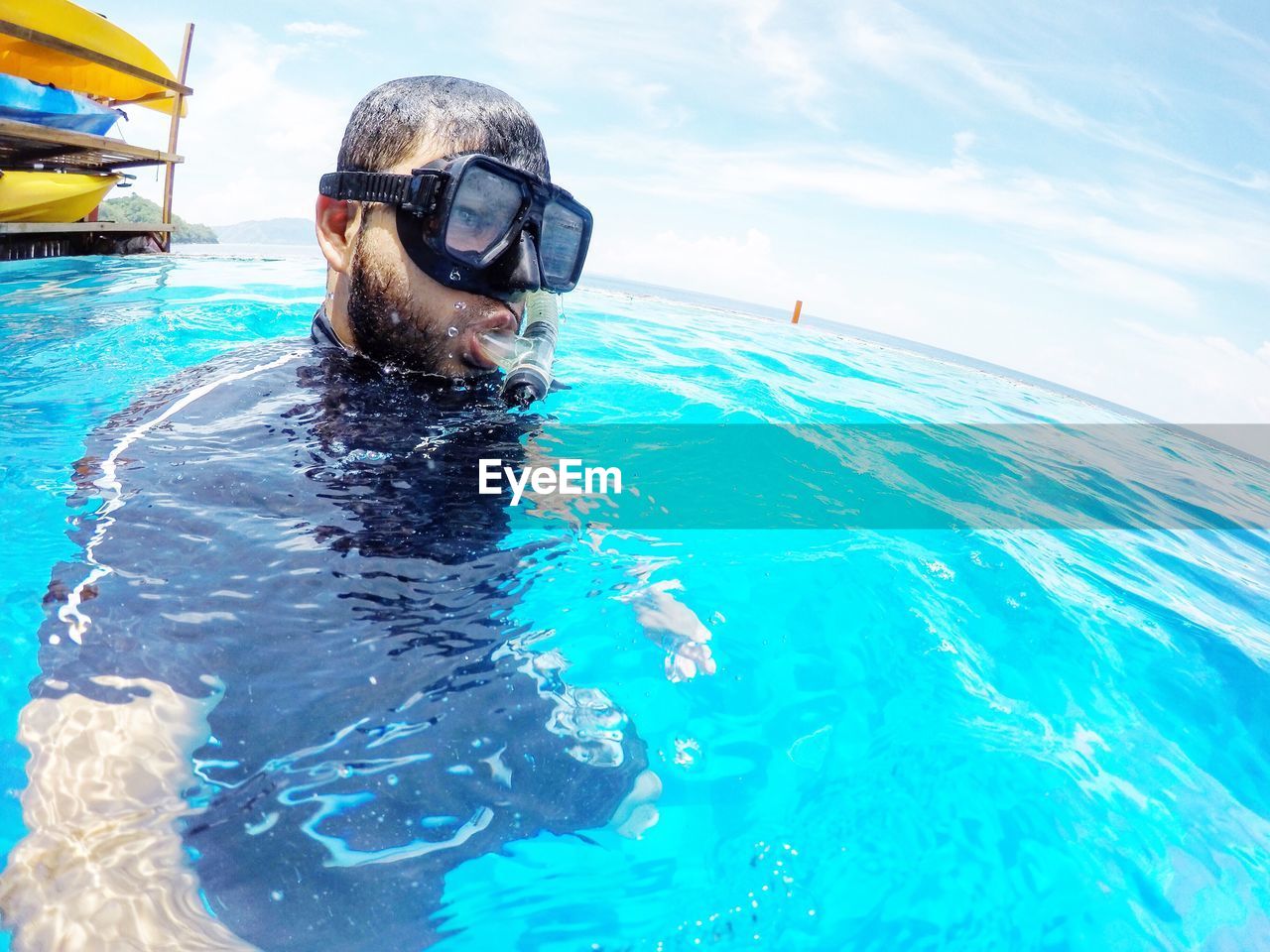 Close-up of man snorkeling in sea