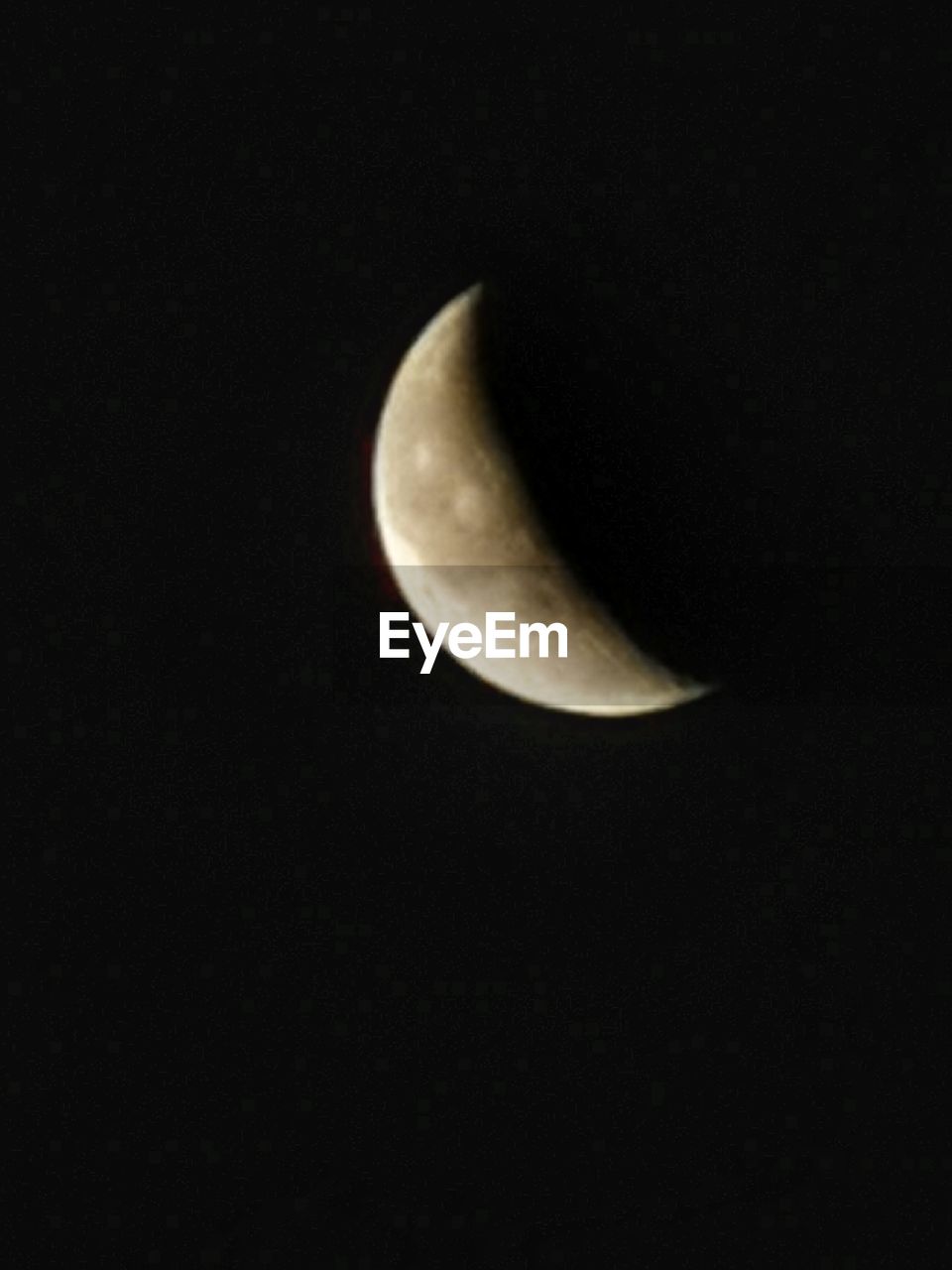 LOW ANGLE VIEW OF HALF MOON IN SKY