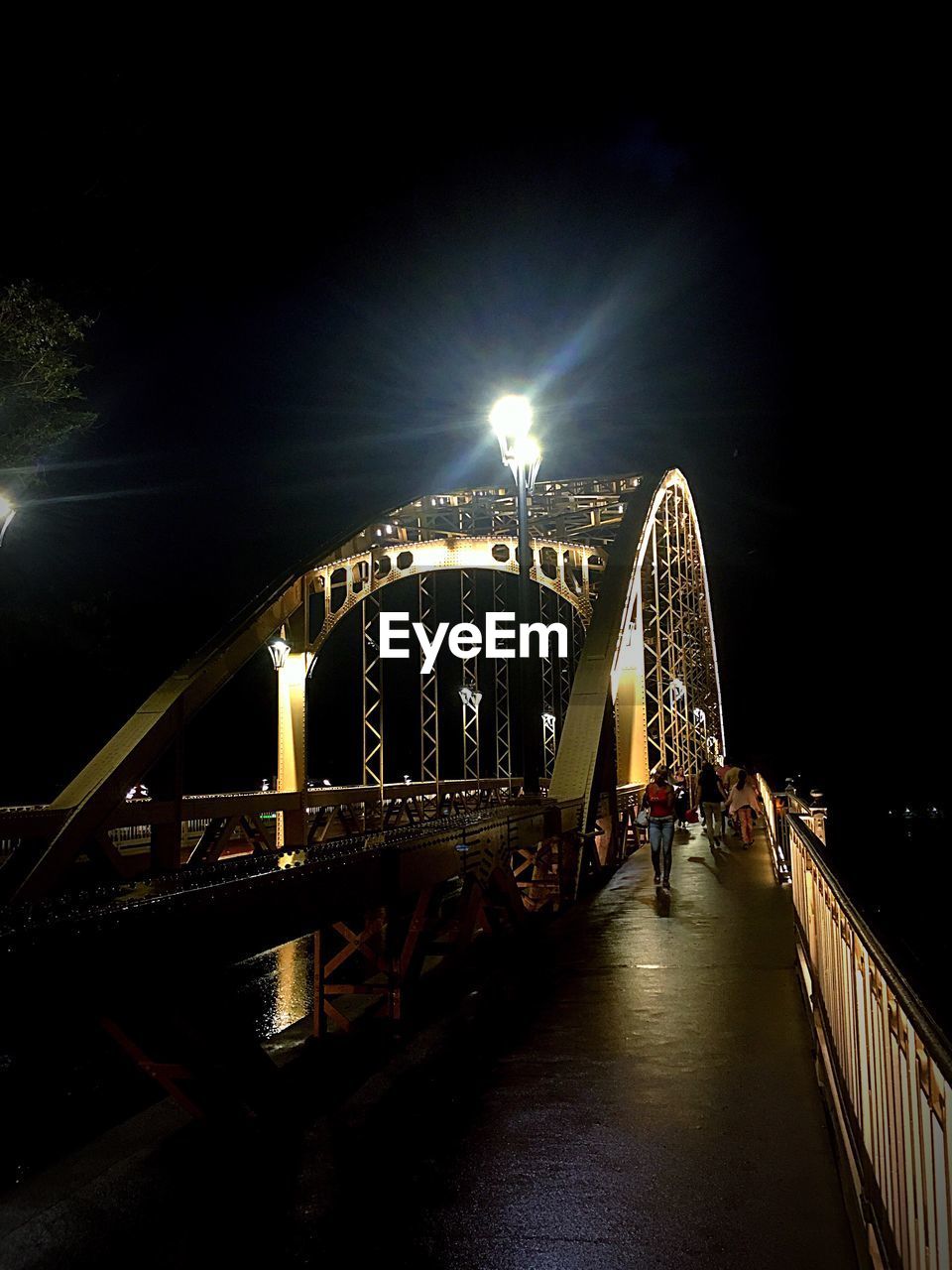 ILLUMINATED BRIDGE AT NIGHT