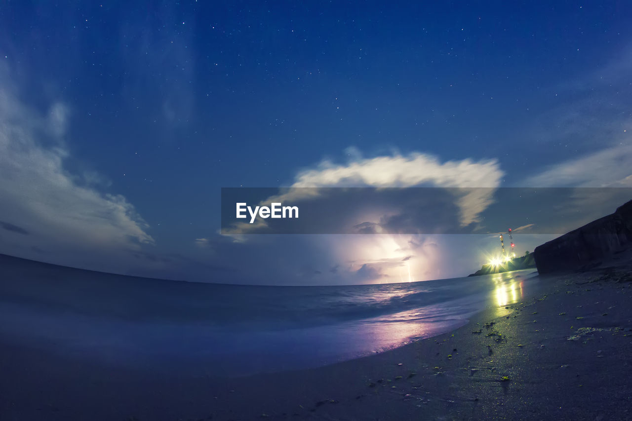 Scenic view of sea against sky at dusk