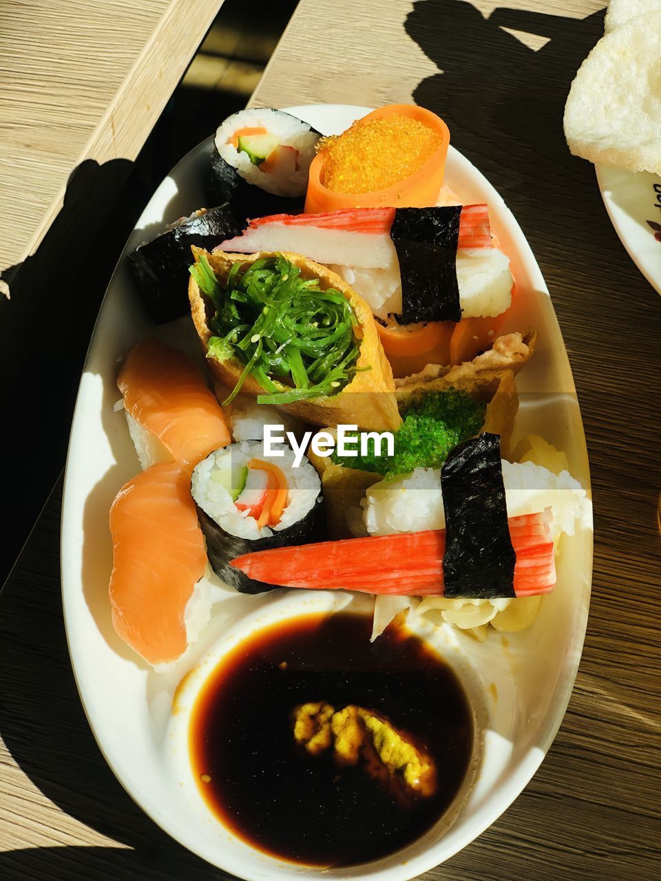 CLOSE-UP OF SUSHI SERVED ON TABLE