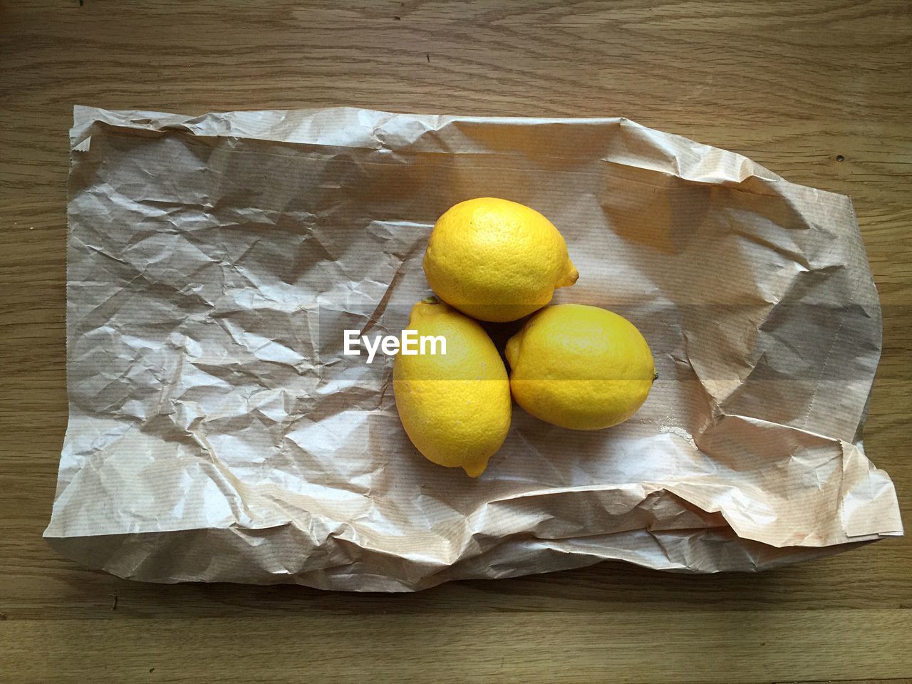 High angle view of lemons on paper bag