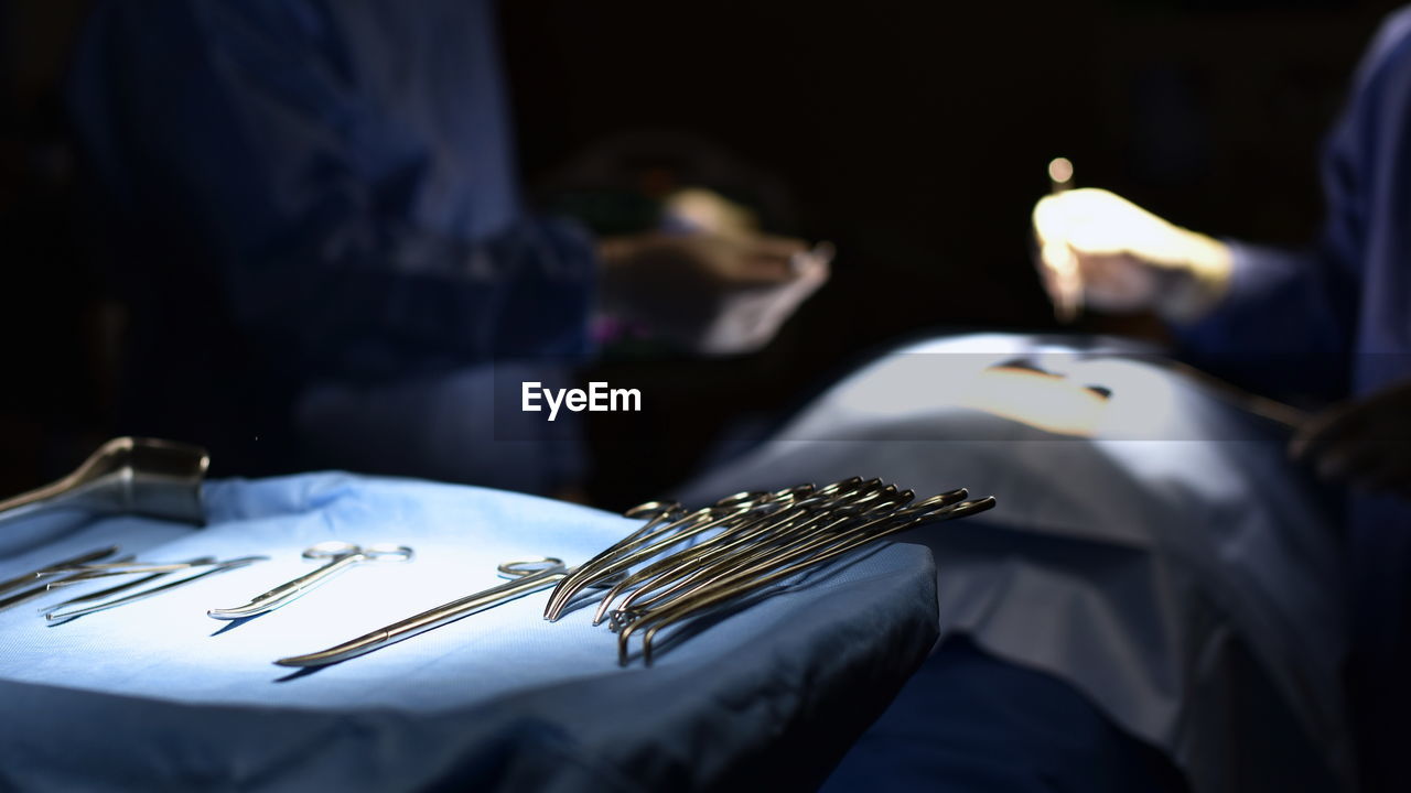 Defocused image of surgeons in operating room