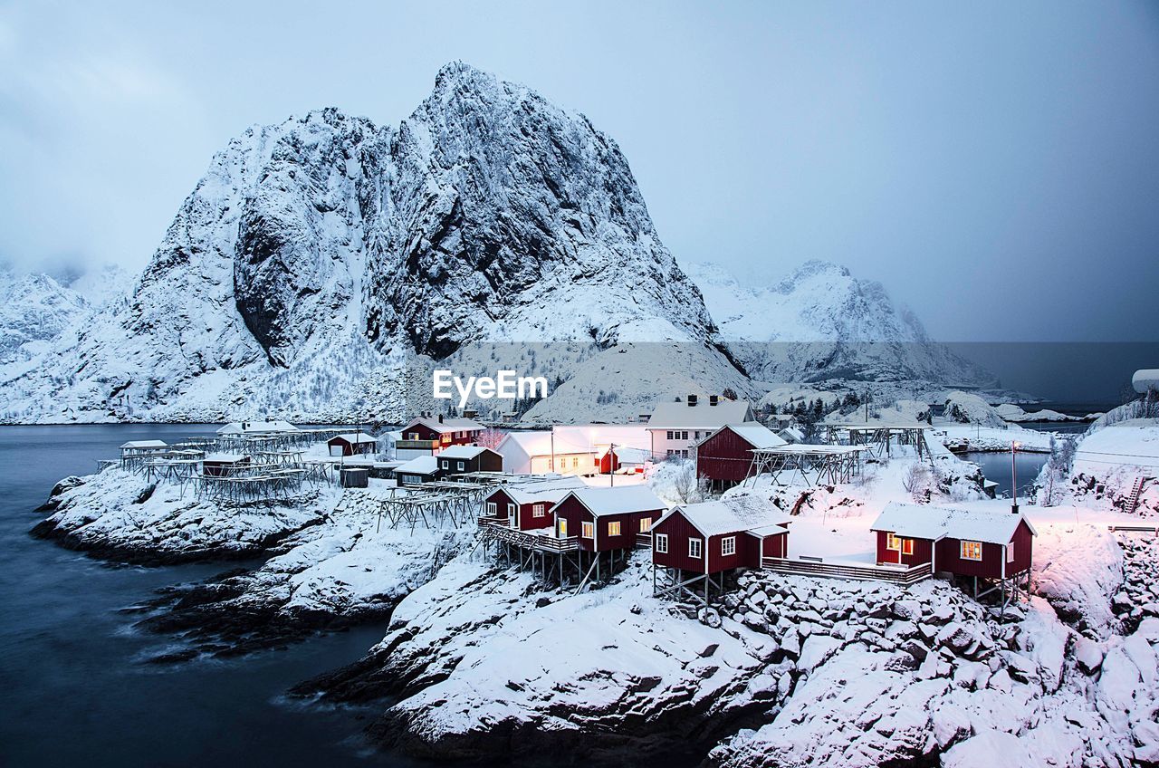 Scenic view of lofoten against snow covered mountains