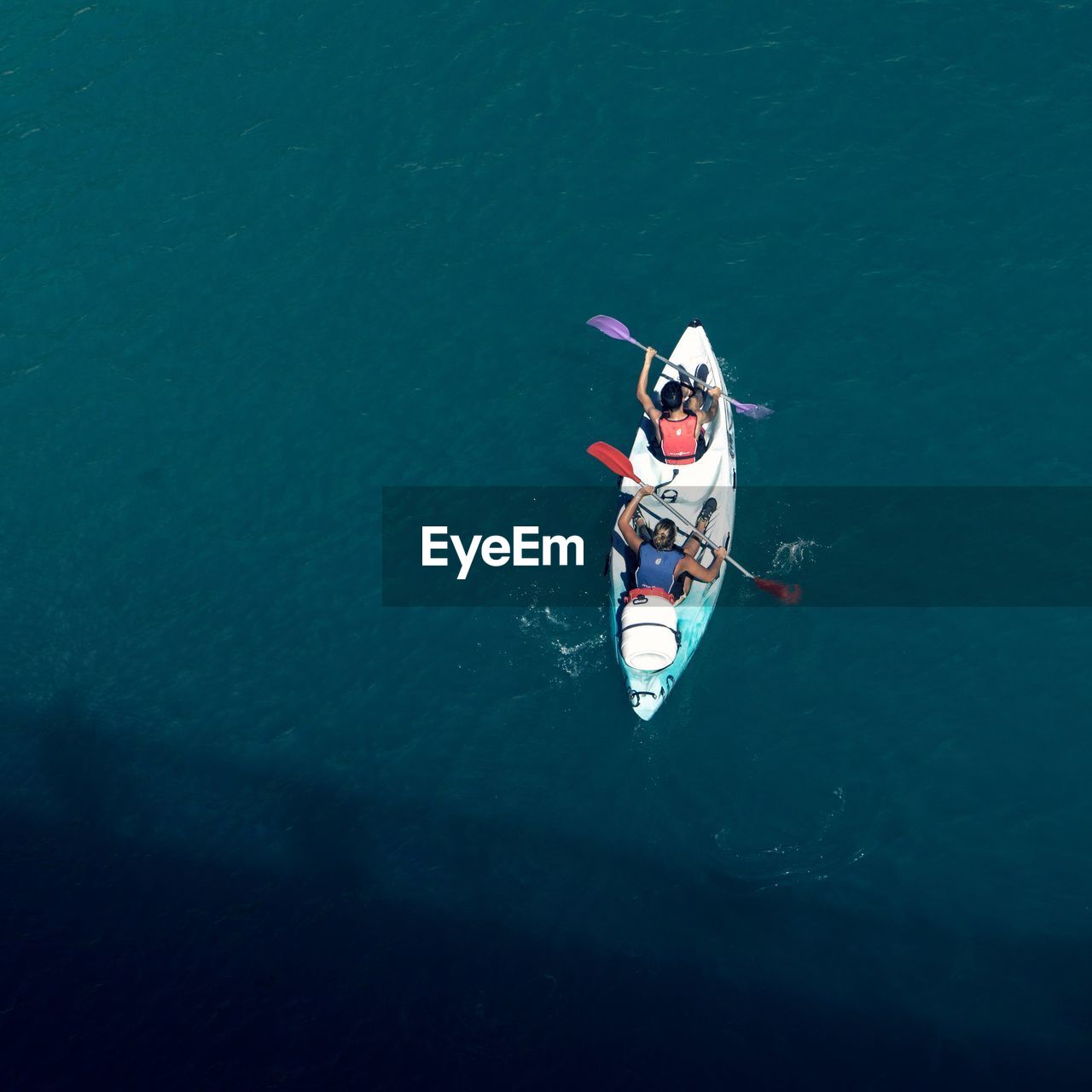 High angle view of people on boat in water