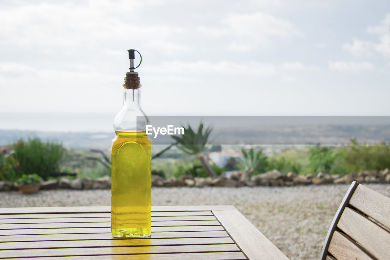 Close-up of olive oil on table