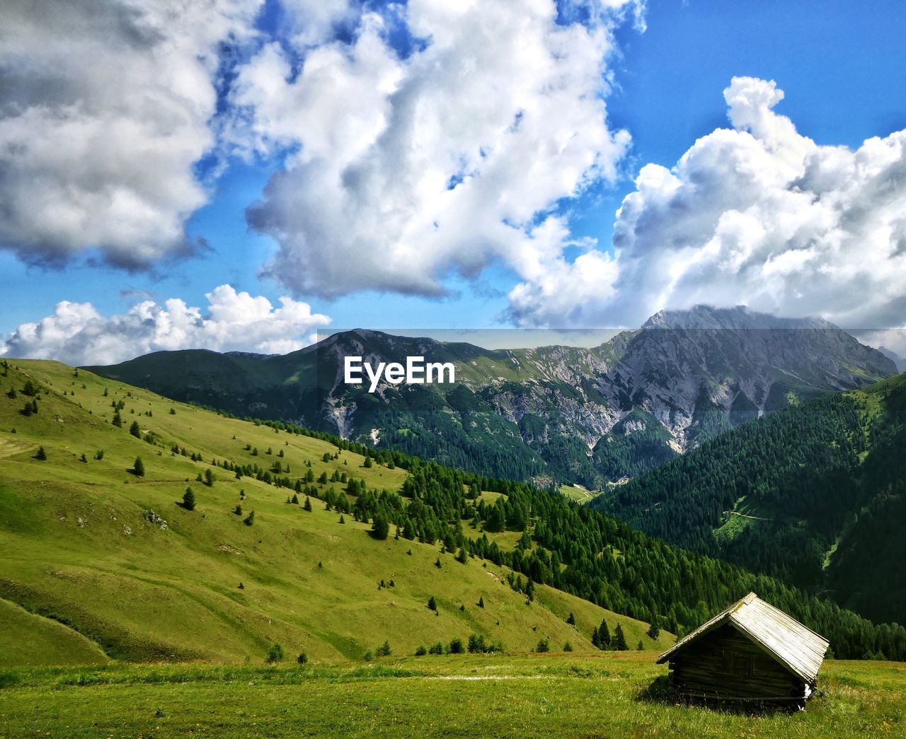 Scenic view of landscape and mountains against sky