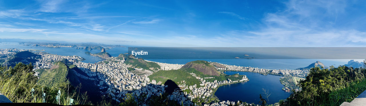 PANORAMIC SHOT OF SEA AGAINST BLUE SKY