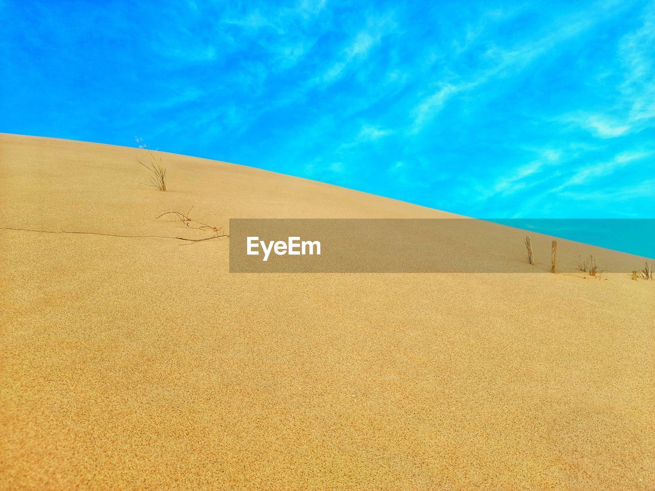 Yellow sand dunes and blue sky