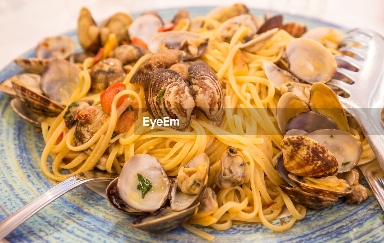 Close-up of noodles served with seafood in plate