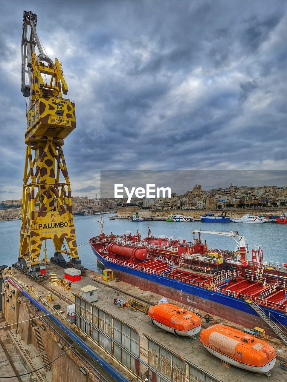 water, vehicle, sky, transportation, cloud, nautical vessel, architecture, sea, nature, port, mode of transportation, boat, pier, industry, harbor, transport, watercraft, built structure, coast, outdoors, no people, freight transport, day, travel destinations, commercial dock, ship, travel, machinery, crane - construction machinery