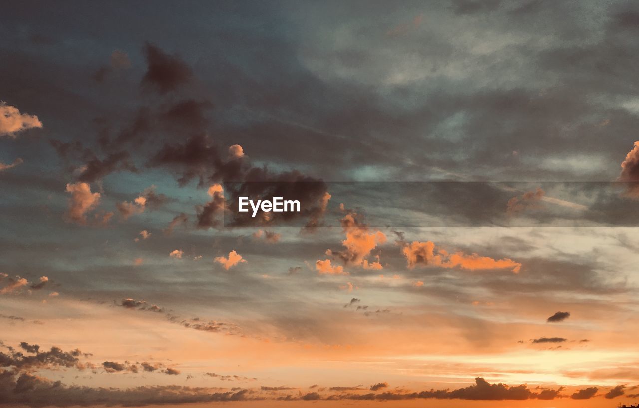 Low angle view of dramatic sky during sunset