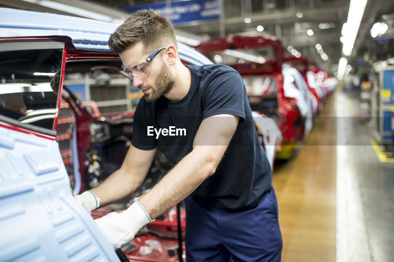 Man working in modern car factory