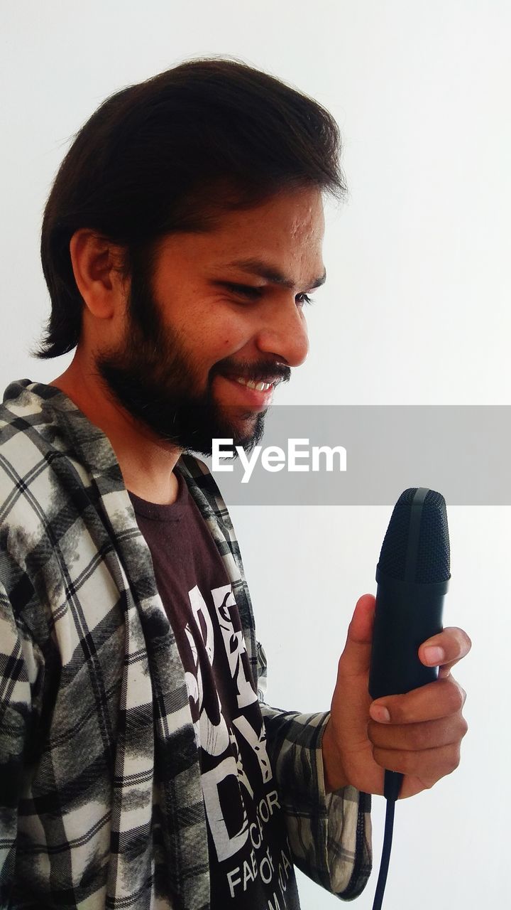 SIDE VIEW OF A MAN SMILING