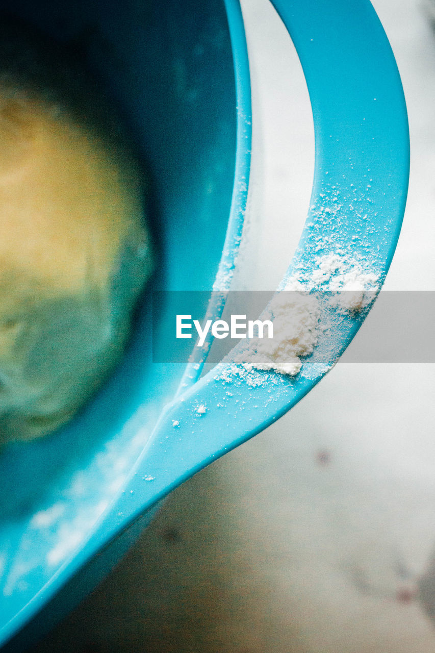 High angle view of flour on handle of container