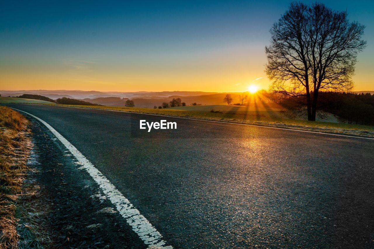 Road against sky during sunset