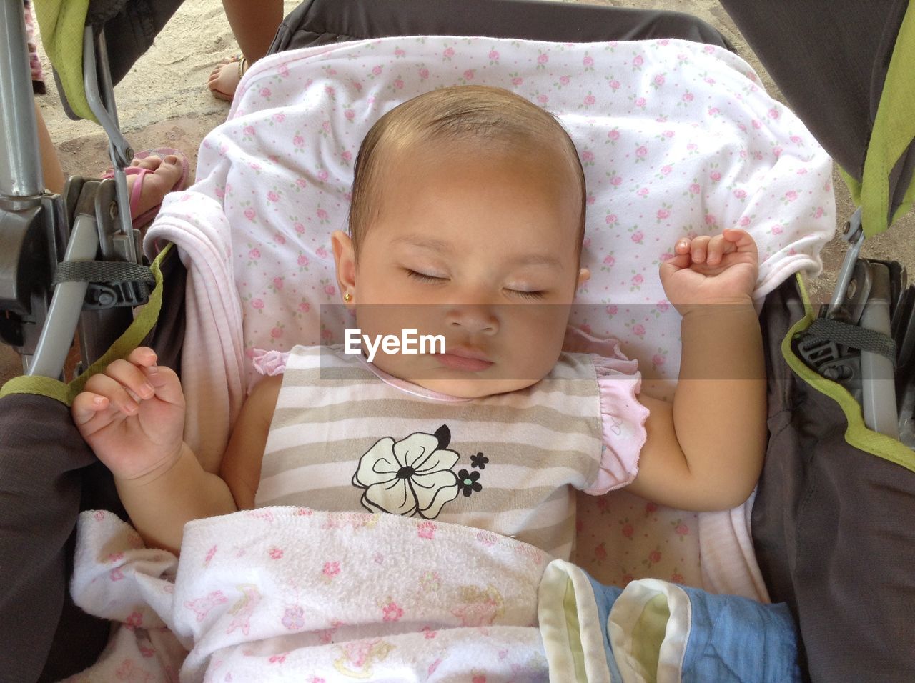 PORTRAIT OF BABY GIRL SITTING ON BENCH