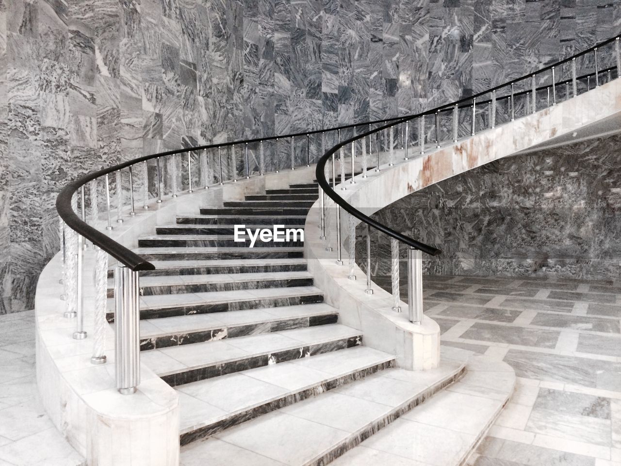 HIGH ANGLE VIEW OF SPIRAL STAIRCASE OF BUILDING