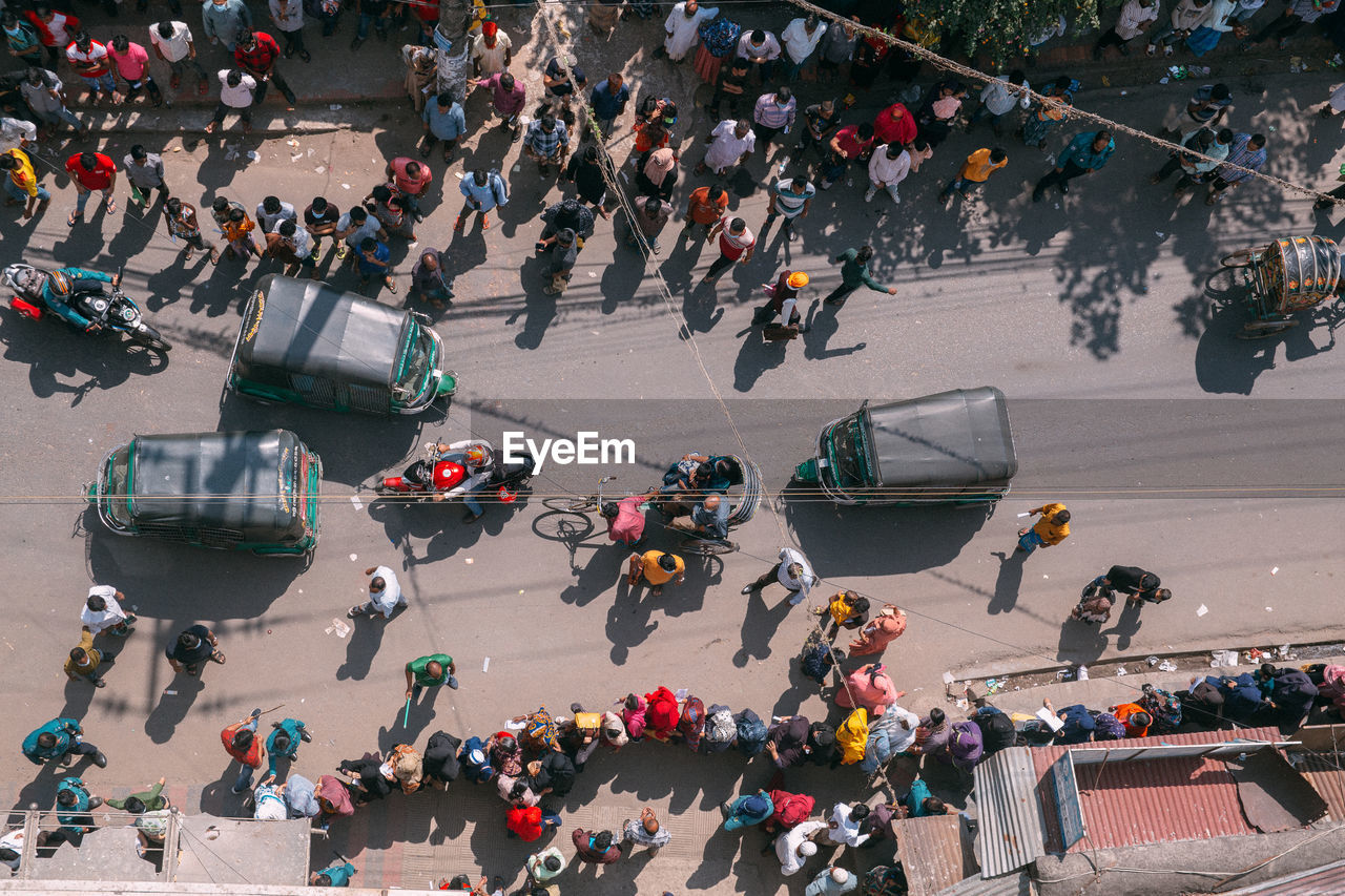 High angle view of people on street waiting for the vaccine in fornt of the hospital 