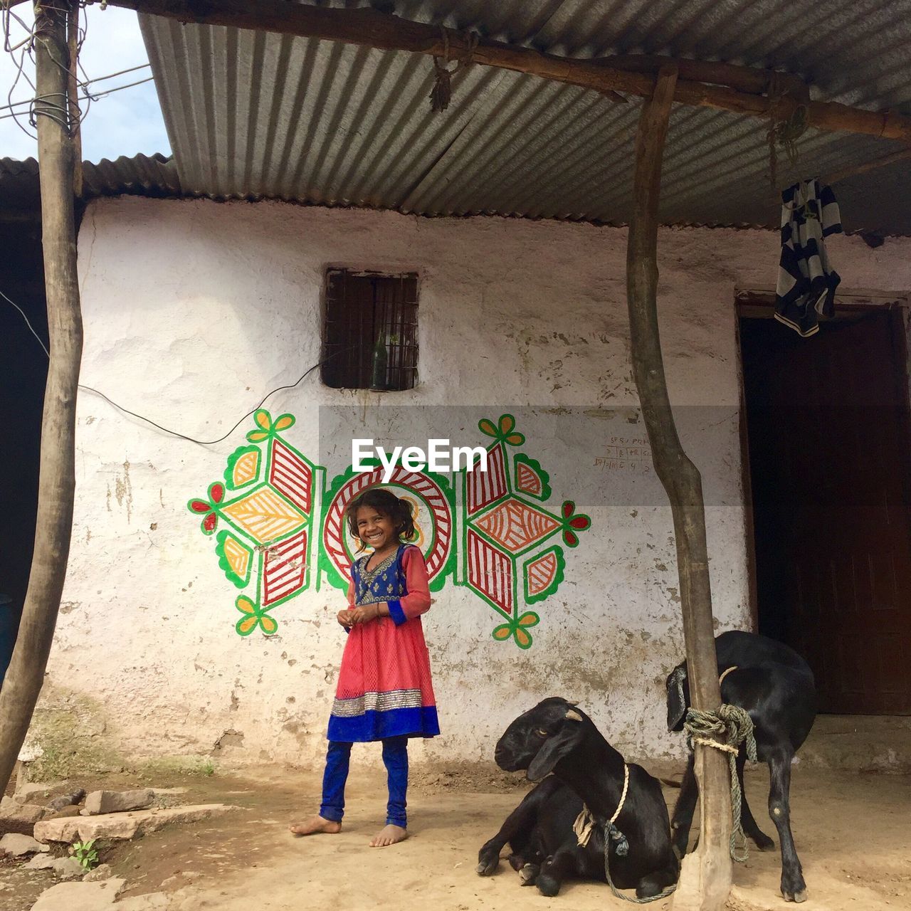 PORTRAIT OF BOY STANDING ON HORSE