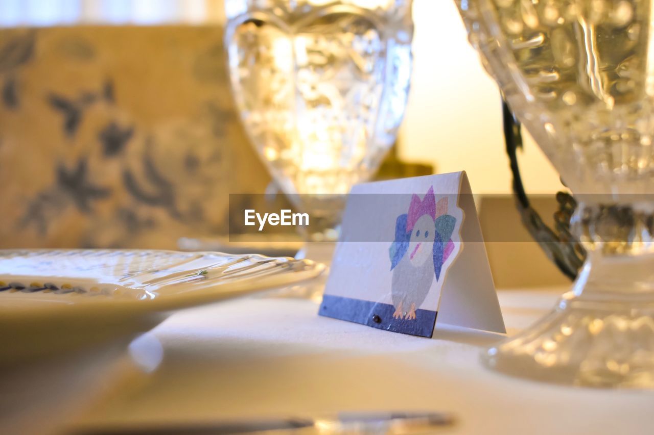 Close-up of glasses on table