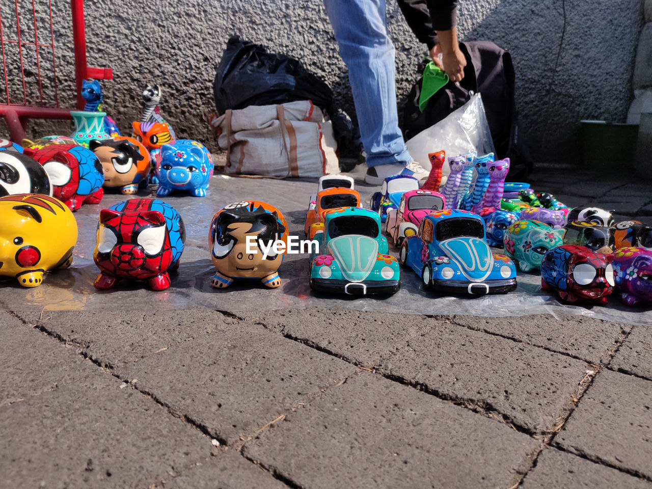 LOW SECTION OF VARIOUS TOYS ON STREET IN CITY