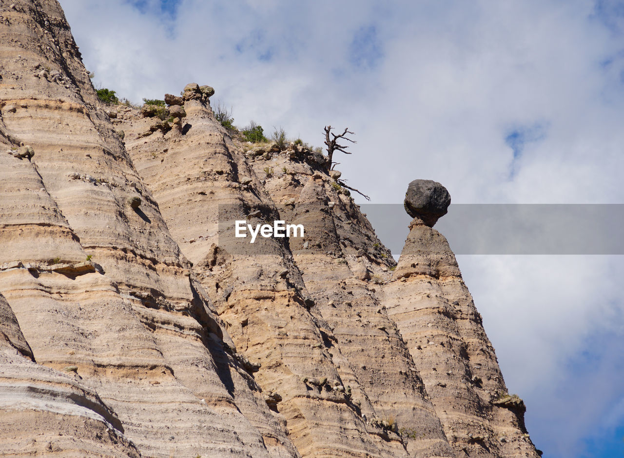 LOW ANGLE VIEW OF ROCKS AGAINST SKY