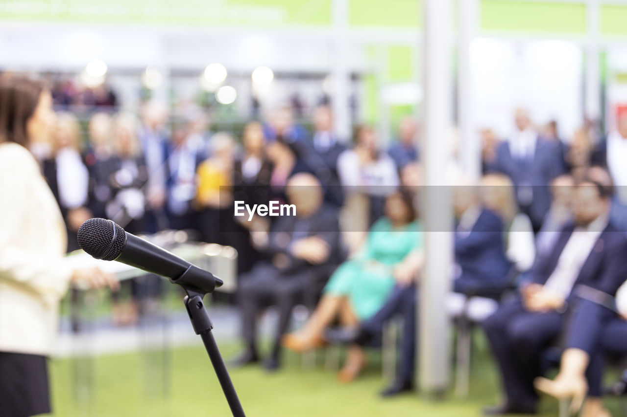 Business conference event or corporate presentation, microphone in the focus