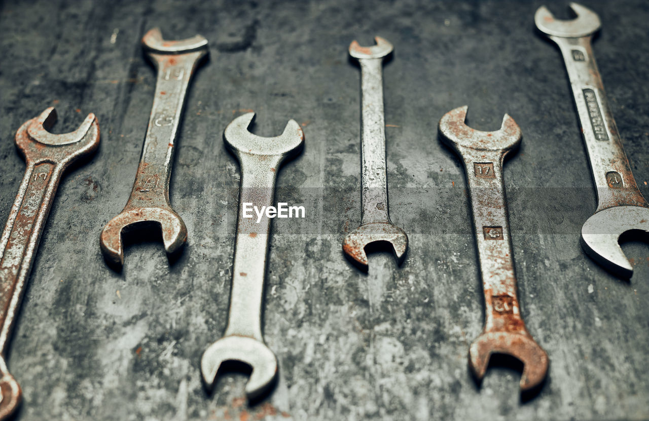 Spanners on steel surface. old rusty wrenches for maintenance. mechanic hardware tools to fix. tech