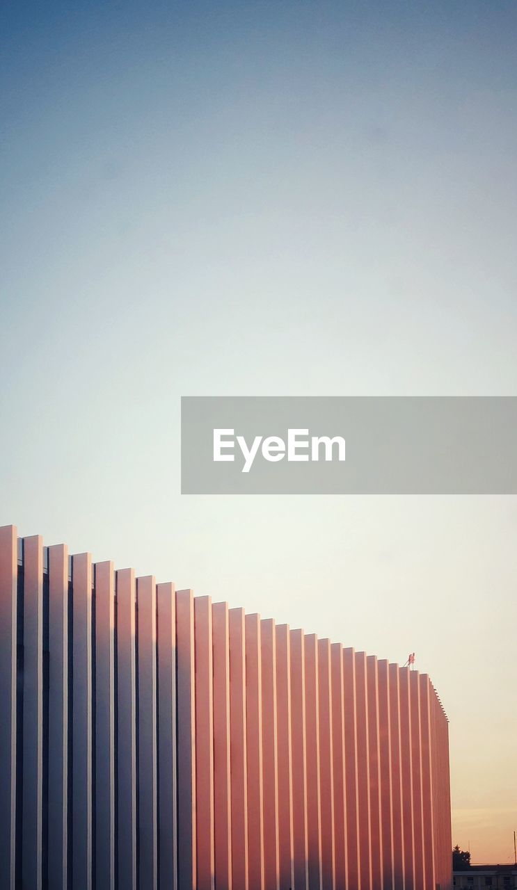 LOW ANGLE VIEW OF OFFICE BUILDING AGAINST SKY