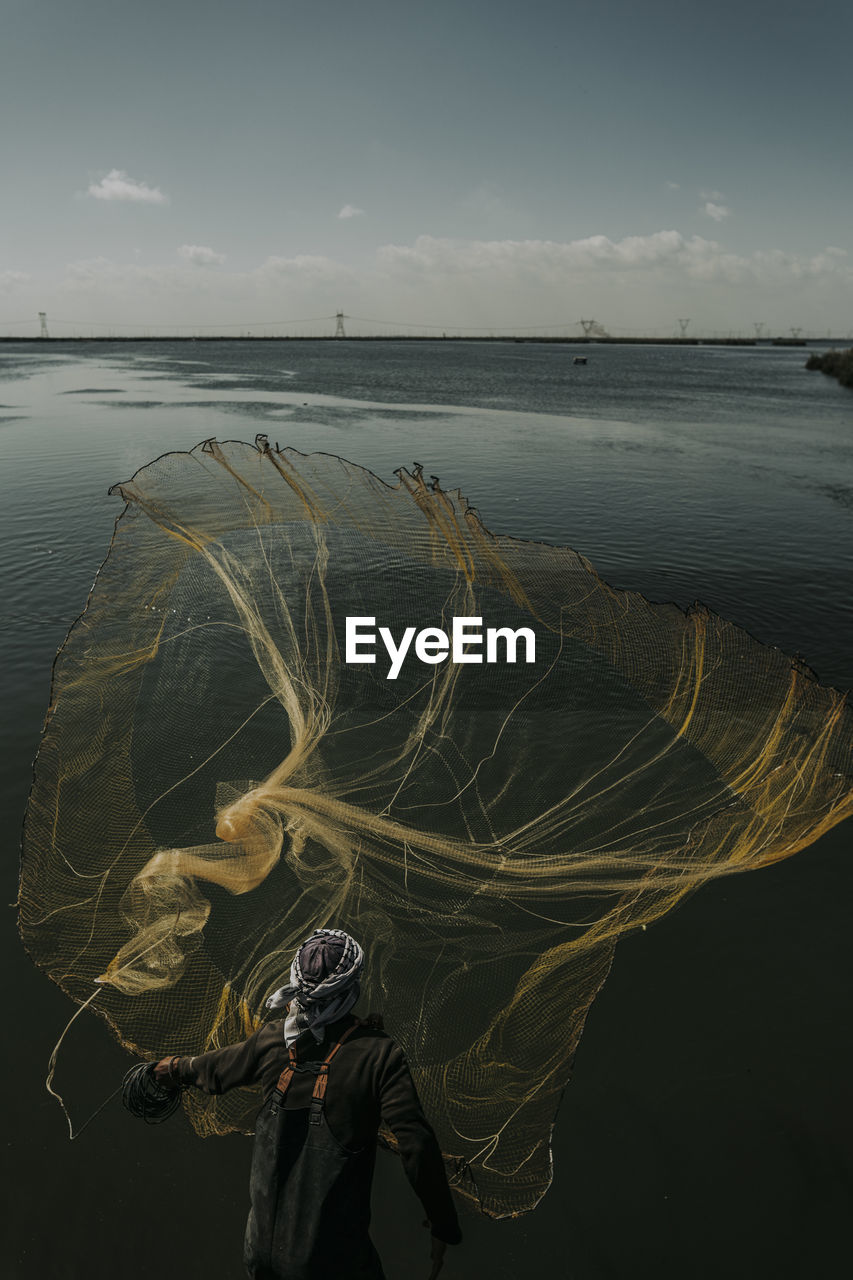 Fisherman in lake