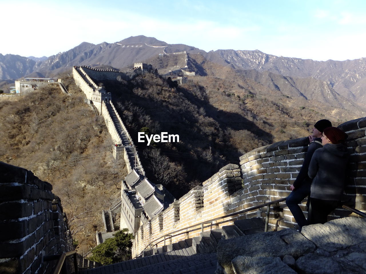 Rear view of young couple standing at great wall of china