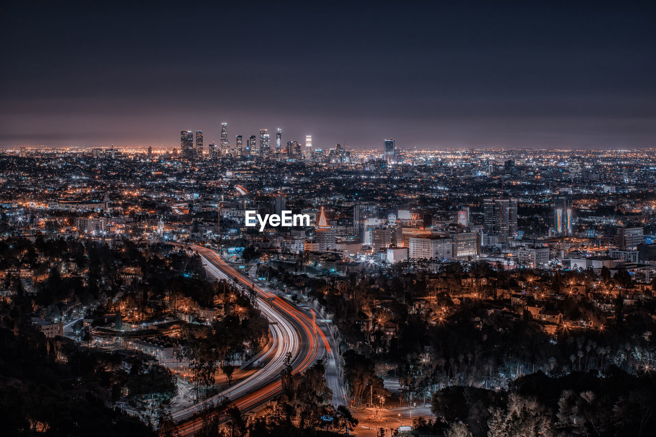 Aerial view of illuminated city at night