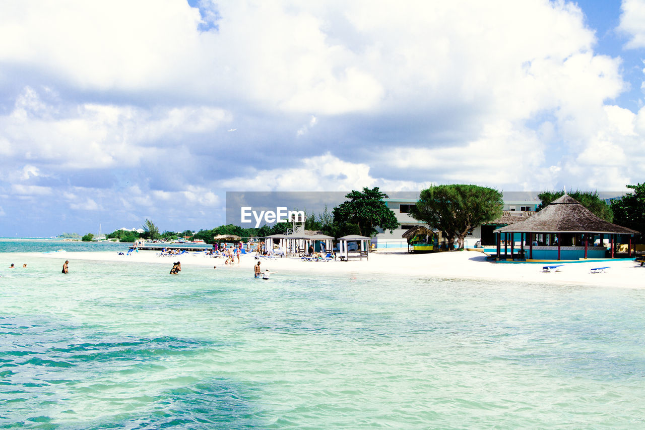 PEOPLE ON SWIMMING POOL AT BEACH