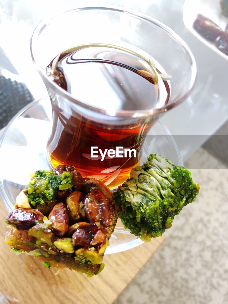 High angle view of baklava with black tea on table 