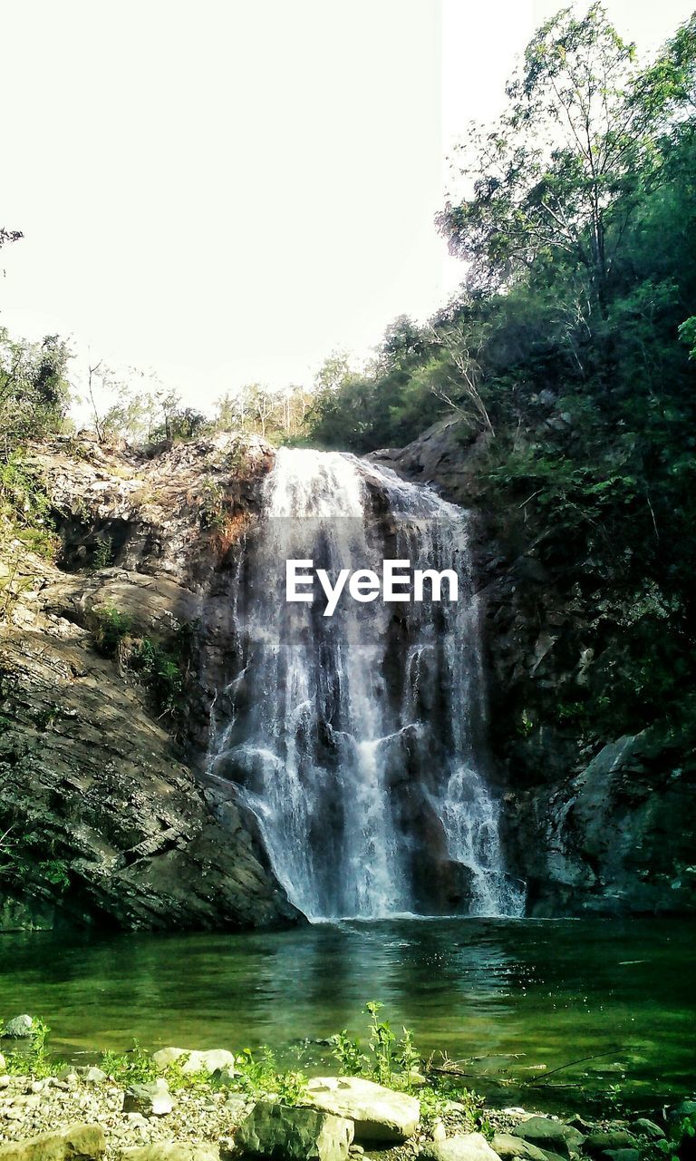 Waterfall with lake in foreground