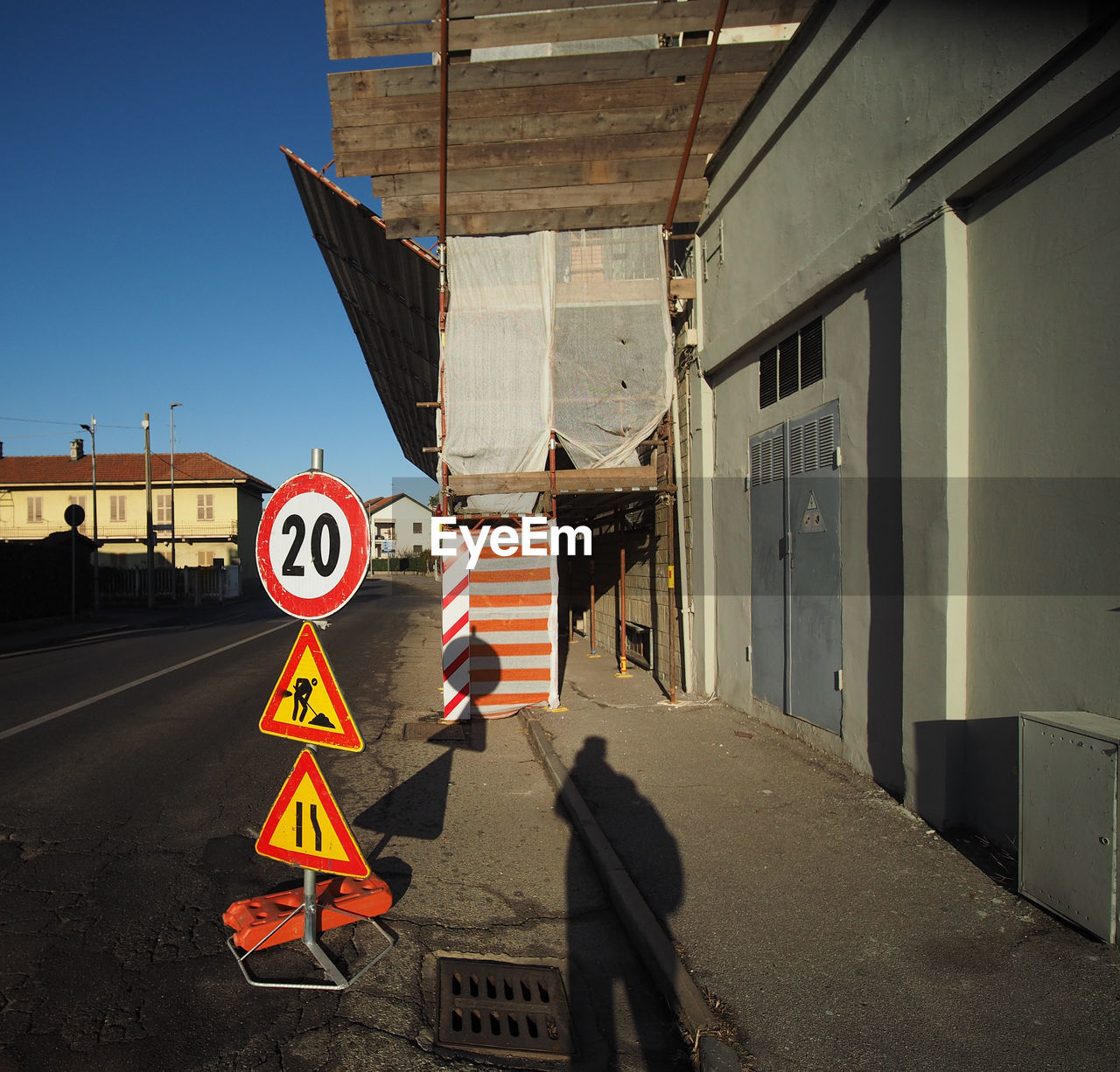 sign, architecture, road sign, urban area, road, communication, transportation, street, city, built structure, day, no people, outdoors, nature, building exterior