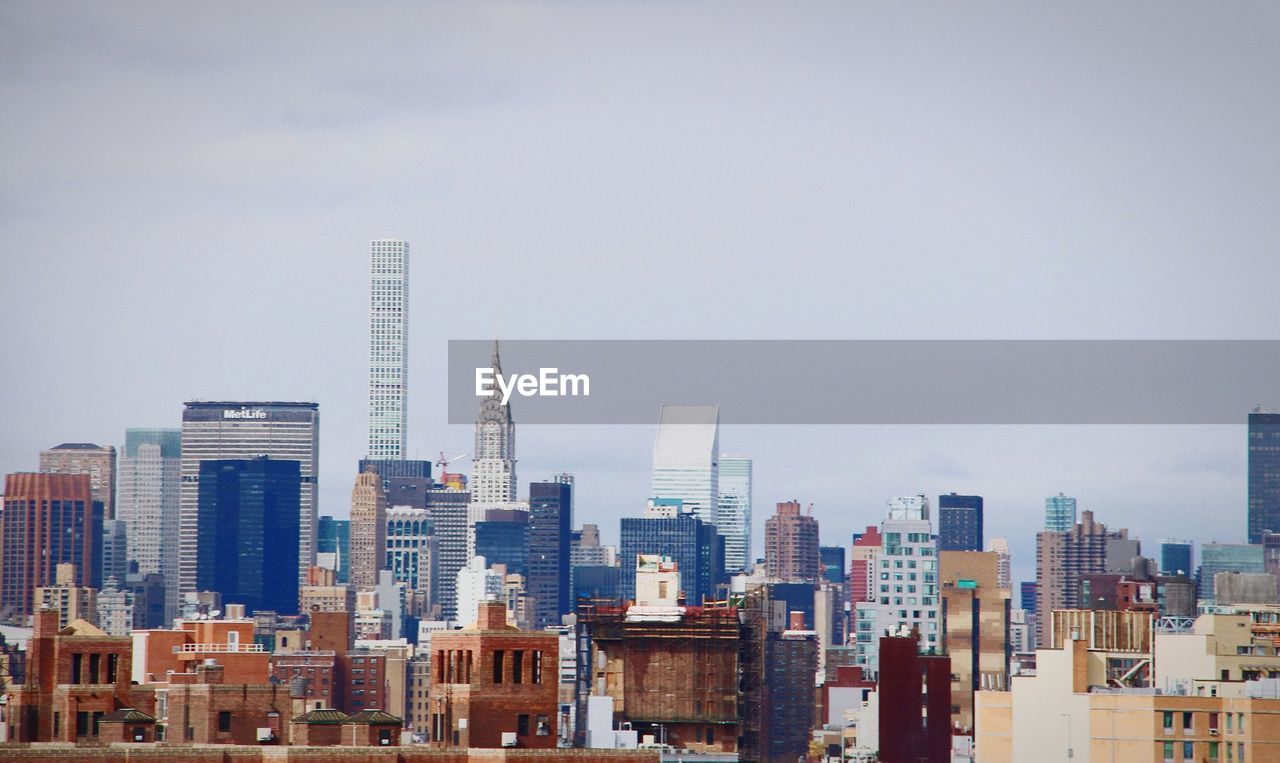 Modern buildings in city against sky