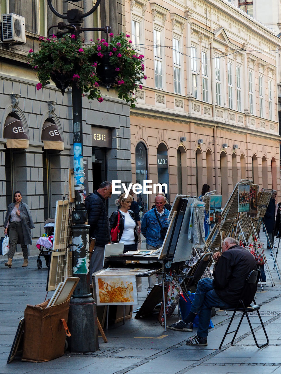 PEOPLE AT STREET MARKET AGAINST BUILDING