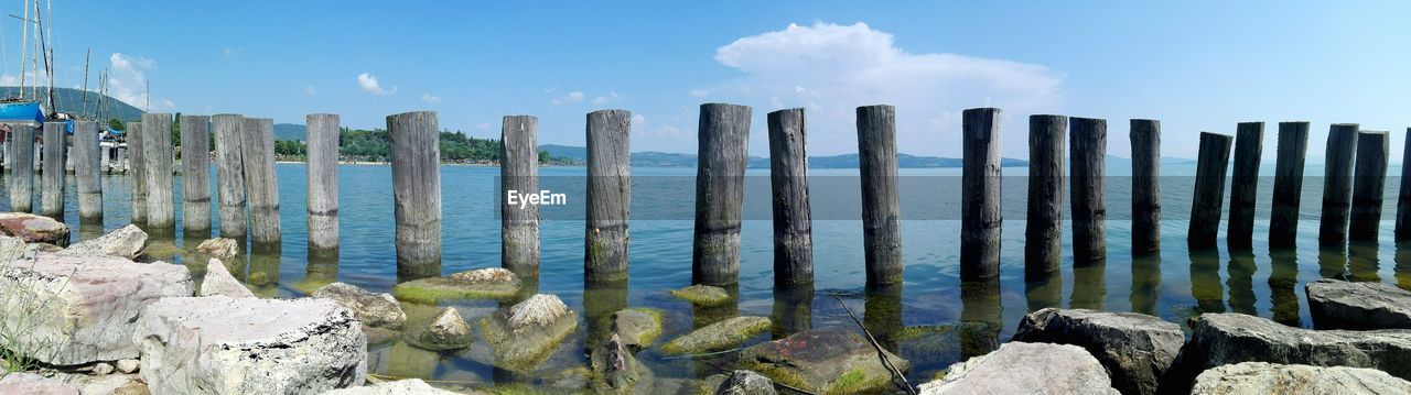 Wooden posts against sky