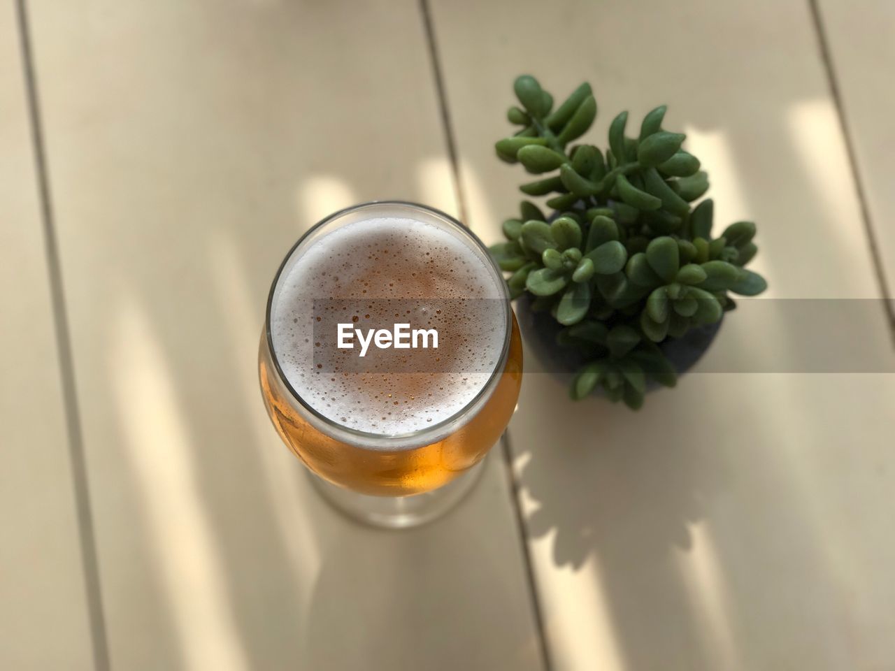 High angle view of glass of beer