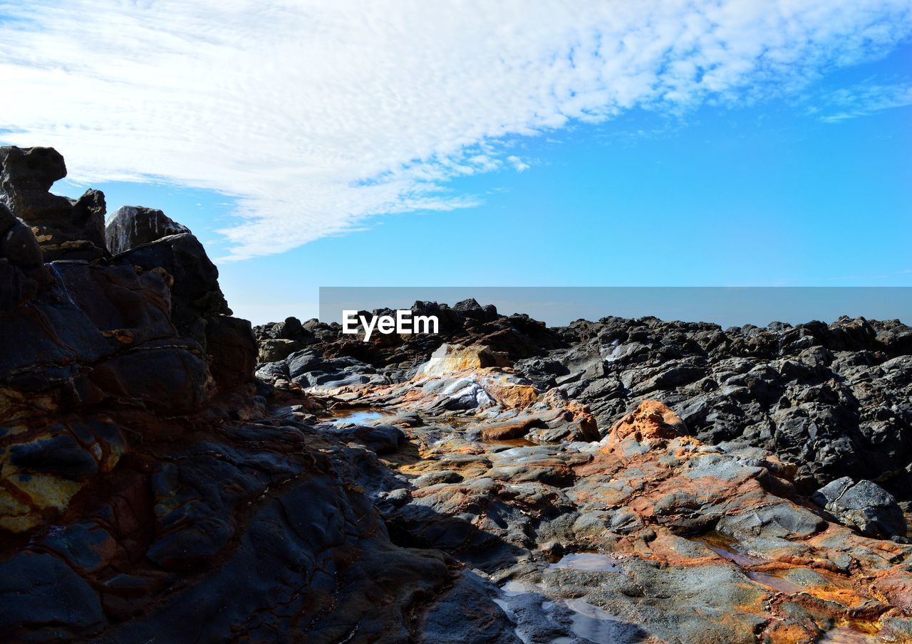 Scenic view of rock formation against sky