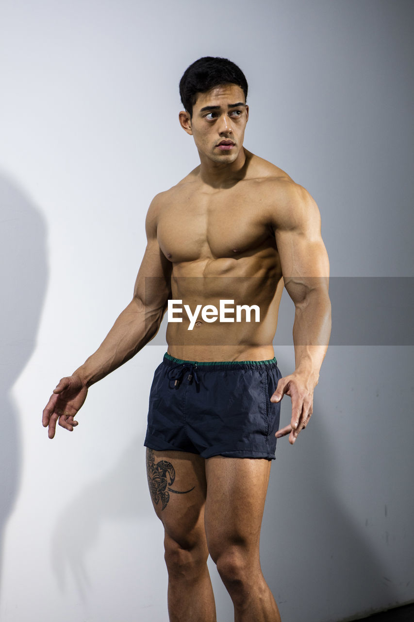 Close-up of shirtless muscular man