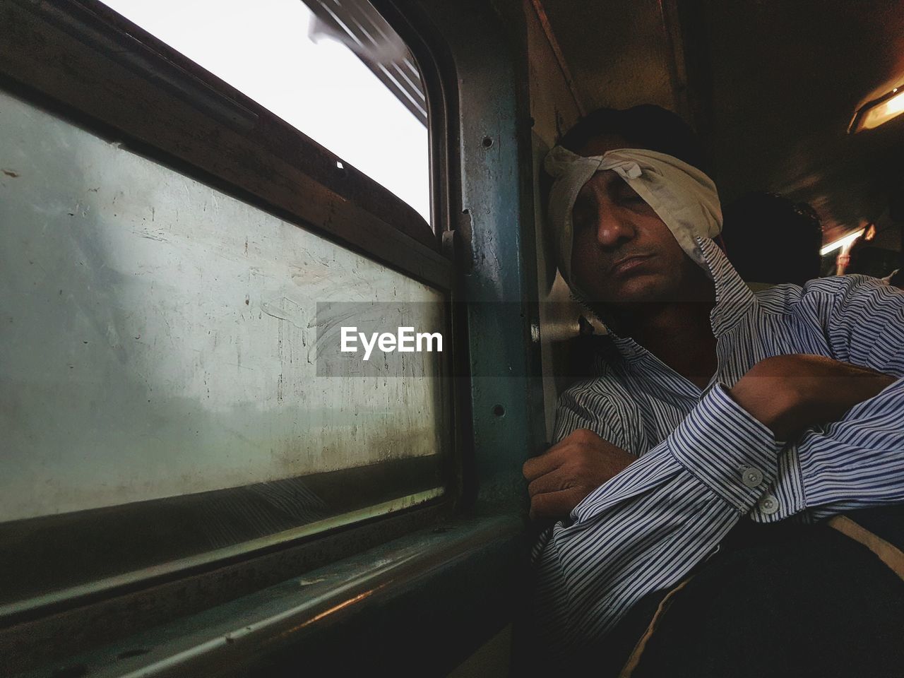 CLOSE-UP OF A MAN WINDOW