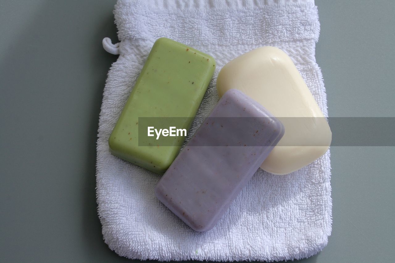 Directly above shot of soap bar on towel