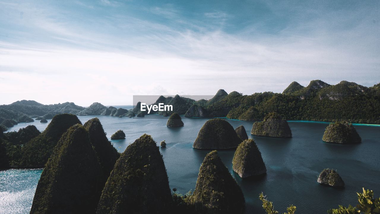 Panoramic view of sea and rocks against sky