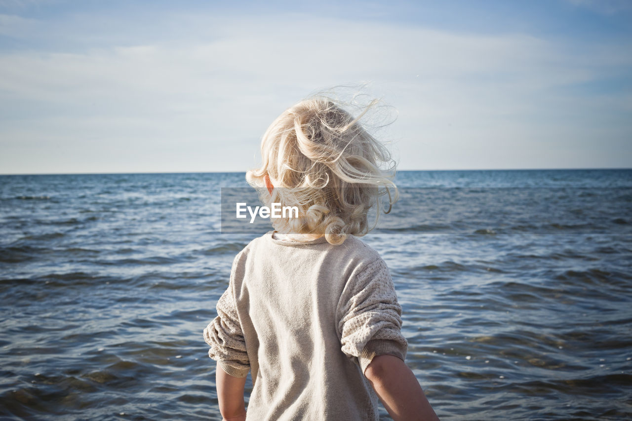 Child looking at sea