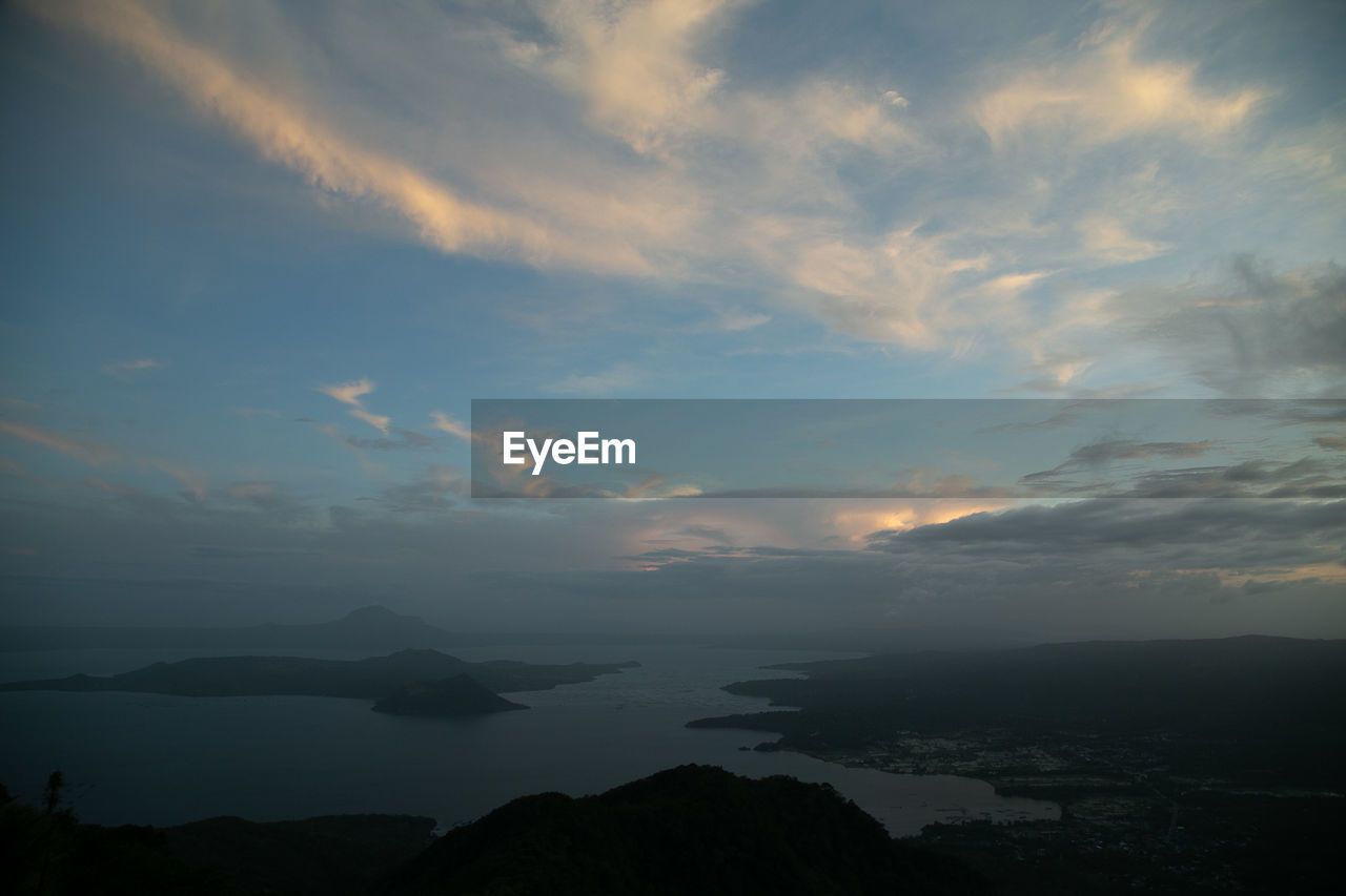 SCENIC VIEW OF SILHOUETTE MOUNTAINS AGAINST SKY DURING SUNSET